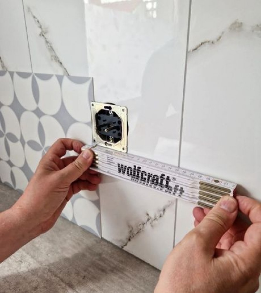 Installing self-adhesive vinyl wall tiles